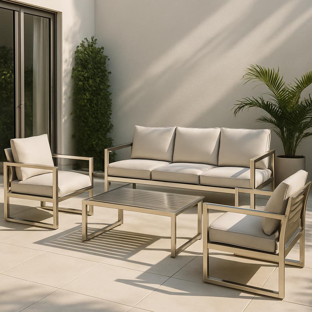 A modern outdoor lounge area with a beige couch, two chairs, and a table.